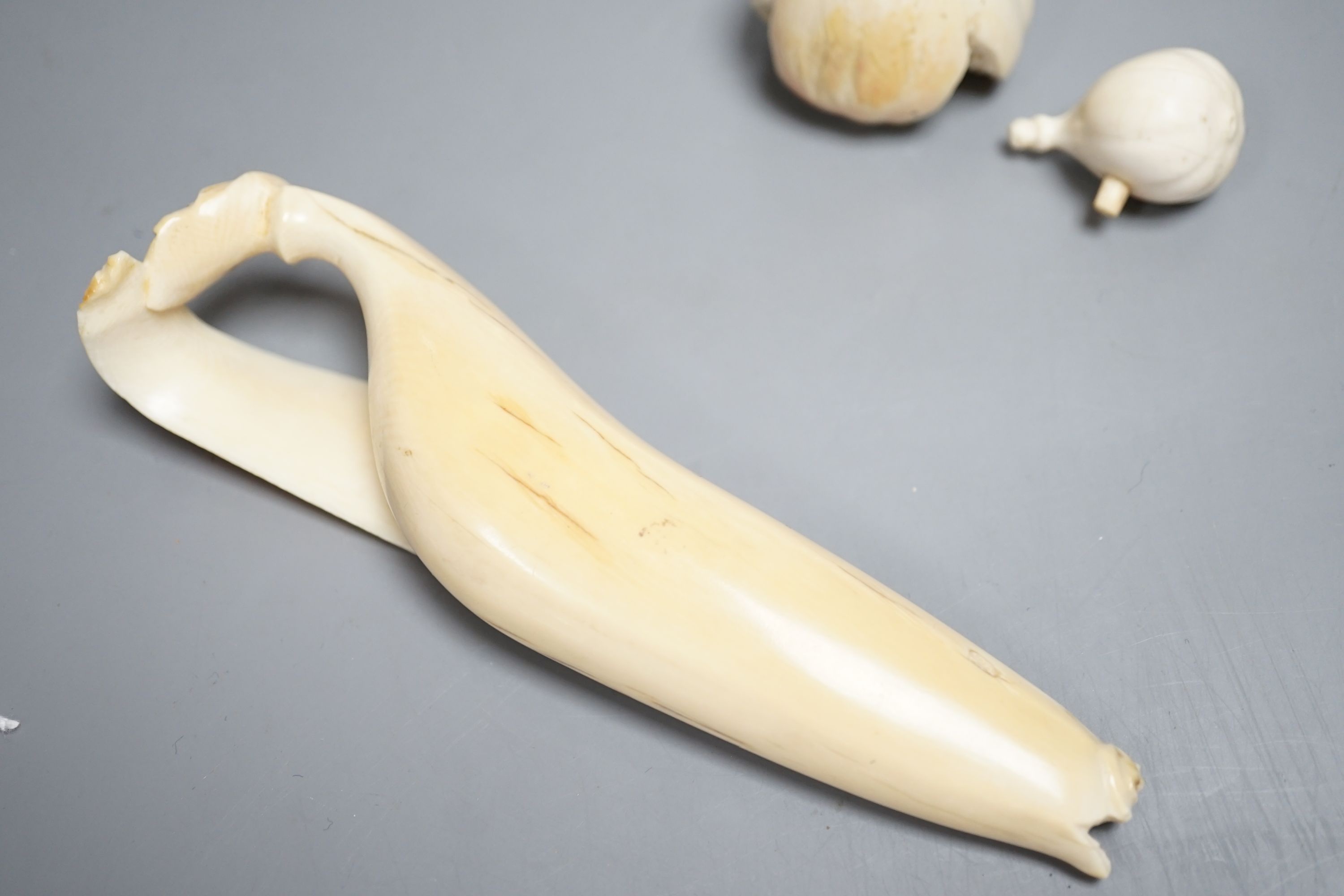 A Japanese ivory model of a partially peeled banana and an ivory model of figs, early 20th century (2) 15.5cm